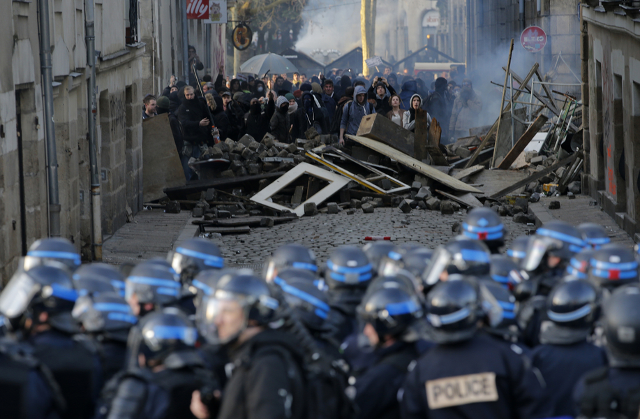 Protesters face off with French CRS riot police as clashes broke out at a march in Nantes, western France, during a demonstration against the construction of a new airport in Notre-Dame-des-Landes